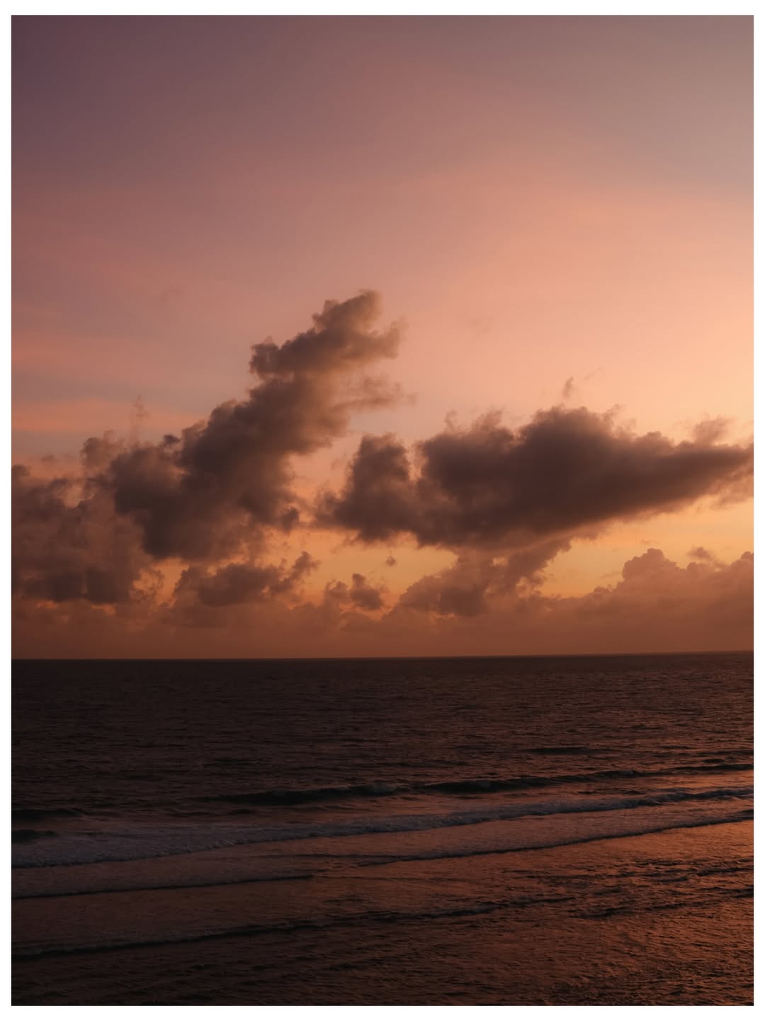 Ocean shoreline at sunset